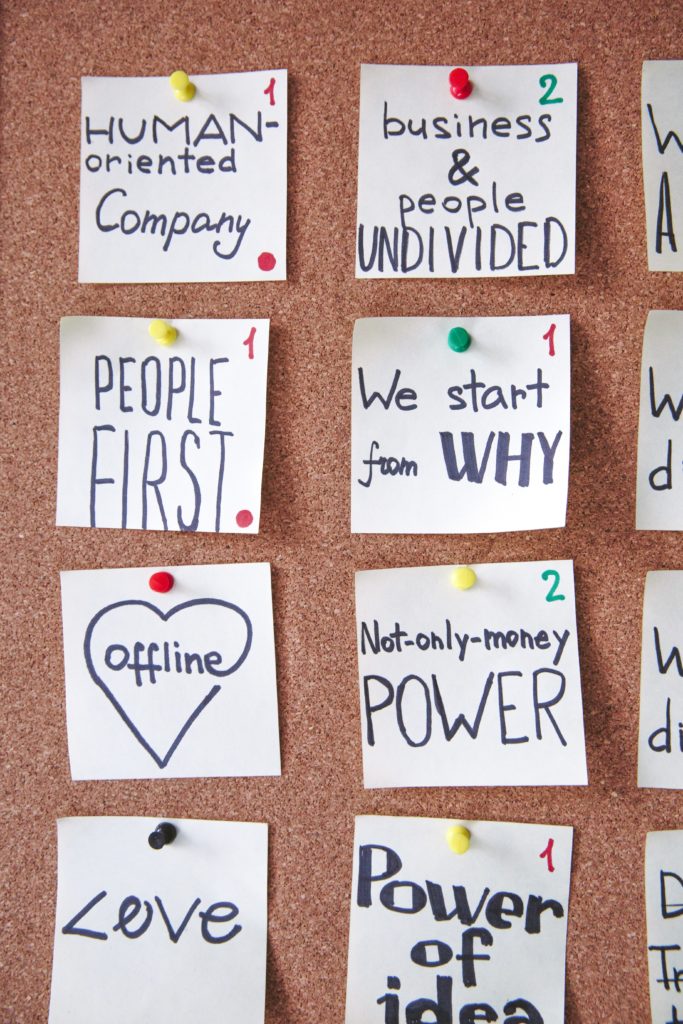 Sticky notes on a corkboard