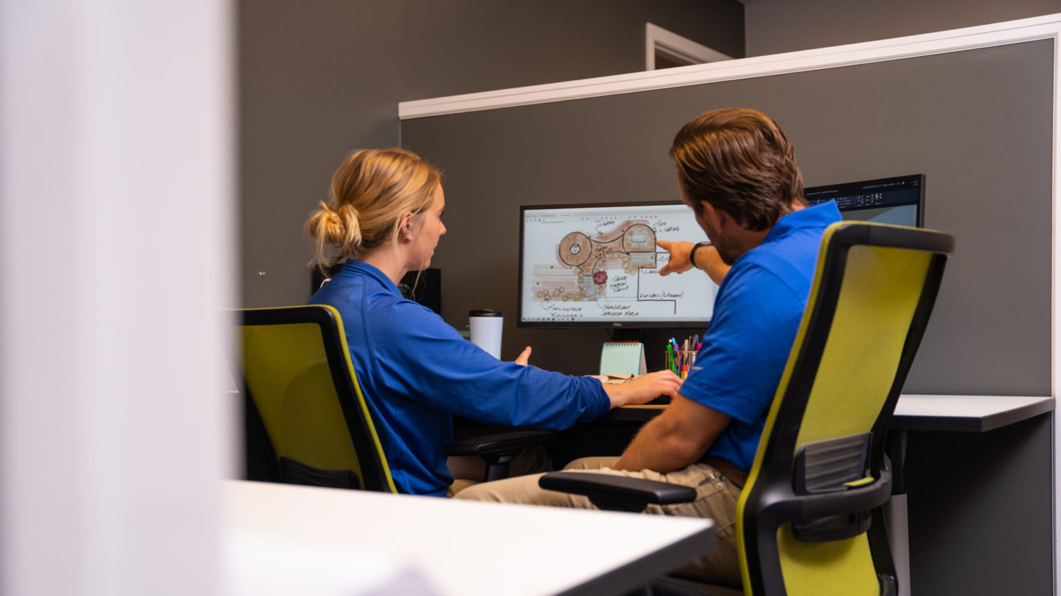 Two people working at a computer