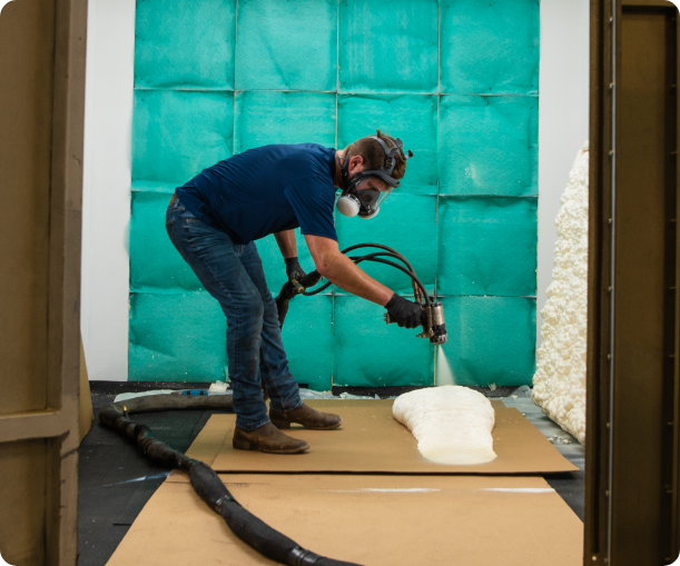 Worker applying spray foam
